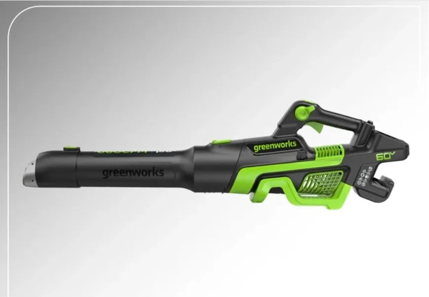 Side view of the Greenworks 60V blower showing the trigger handle, air intake and empty battery bay