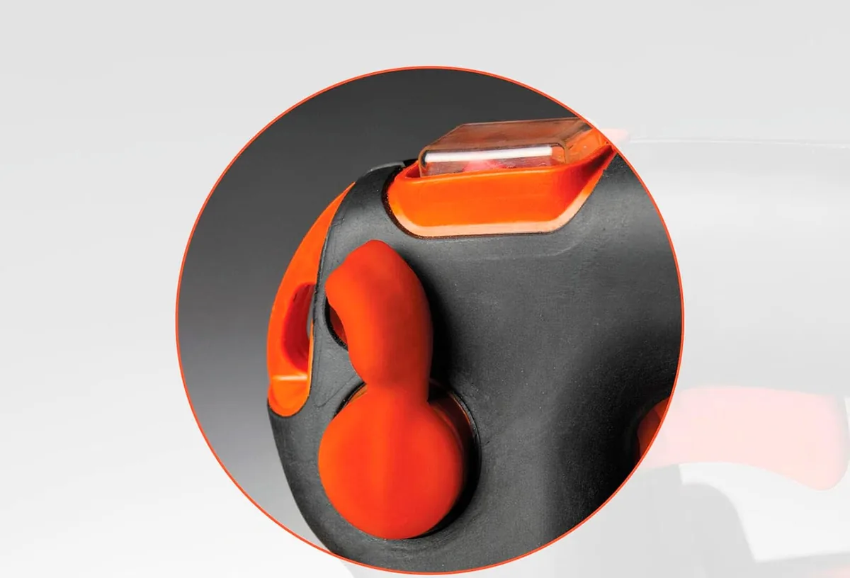 Close-up of the multi-speed throttle trigger with cruise control on the Husqvarna 125BVx blower