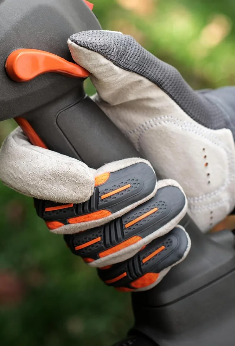 Gloved hand on the throttle handle with orange trigger of the Husqvarna 150BT backpack blower